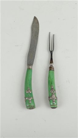 A set of travel cutlery consisting of a knife and a meat fork, handles in...