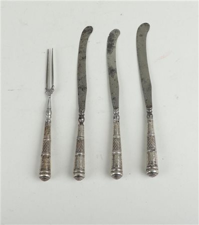 An 18th century silver-handled cutlery set consisting of three butter knives...