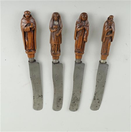 A set of four German 19th century knives with (palm)wood figures of saints....