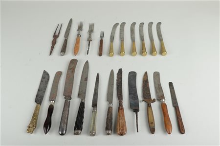 A large lot of antique forks and knives with various handles.