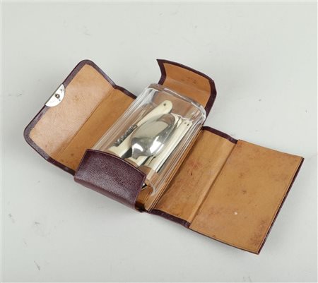 A travel set consisting of a corkscrew, knife and cutlery with bone handle,...