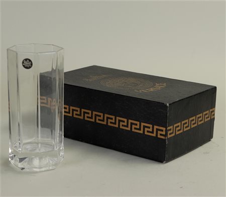 A Versace long drink glass with Medusa head in the bottom. In original...