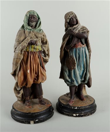 A set of two plaster polychrome painted statues of Arab figures, marked BB on...