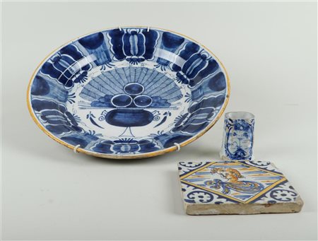 A lot of earthenware consisting of a large peacock dish, a vase and an orange...