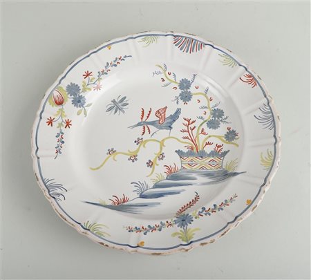 A fiance polychrome painted dish with decoration of birds and flowers, marked...