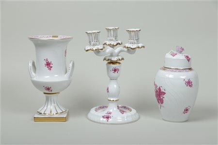 A set consisting of a 3 light candlestick, lidded vase and vase with ears in...