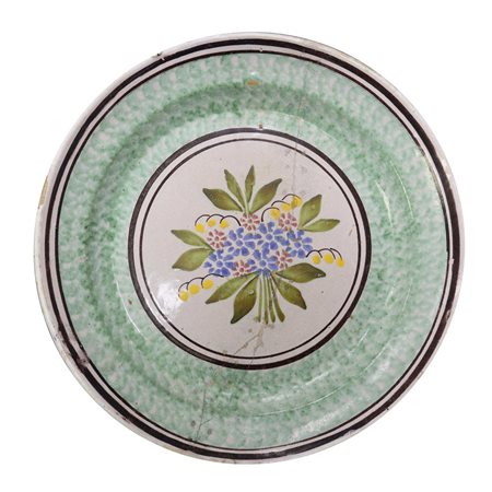 Piatto in maiolica di Caltagirone spugnato verde, con fiore al centro, Primi the 20° secolo