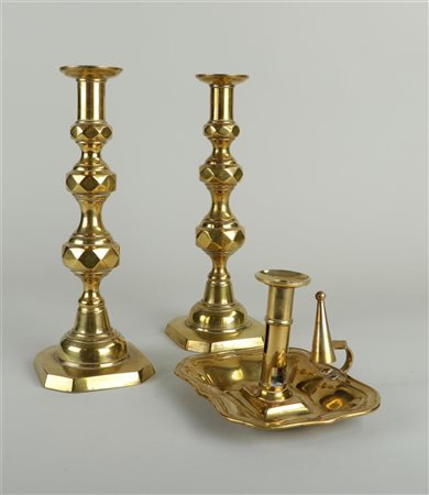 A lot consisting of two candlesticks and a sconce. 19th century.