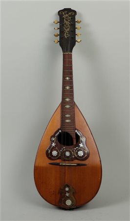 A mother-of-pearl inlaid mandolin, 19th century. Some strings missing.