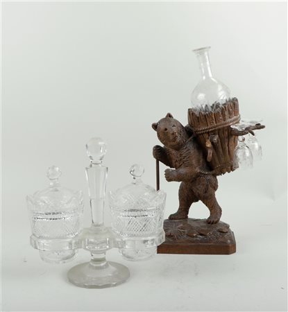 A carved Black Forest liqueur holder in the shape of a Bavarian bear. Minor...