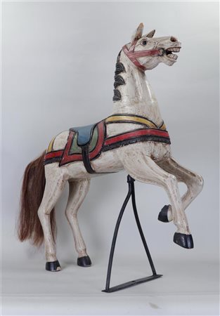 A polychrome wooden carousel horse. 20th century,85 x 70 cm.