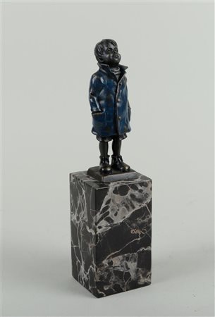 A bronze cold-painted statue of a boy in a raincoat, on a marble base. After...