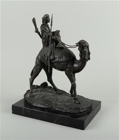 An oriental bronze statue of an Arabian on a dromedary, in the style of...