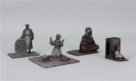 A lot of four cold painted metal figures in Bergmann style.