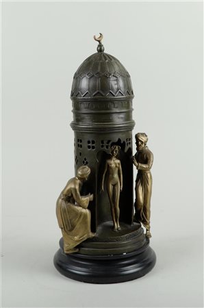 A bronze statue of a lady in a dome tower and two Arabs, in Bergmann style.H....