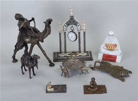 A lot of Oriental objects including sculptures and a pocket watch pendant...