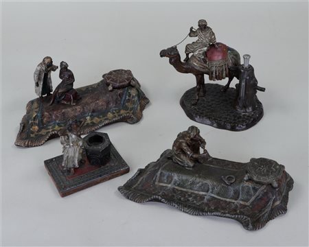 A lot of four cold painted metal figures including inkwells in Bergmann style.