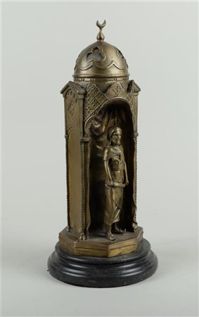 A bronze statue of a lady and an Arab in a dome tower, in Bergman style.H. 34...