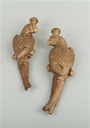 A set of cast iron wall sconces in the shape of a parrot.H. 37 cm.