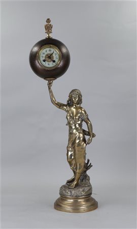 A large bronze sculpture of a lady with a clock in her hand. Clock is...