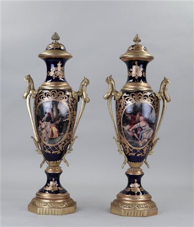 A set of two Sévre style vases with bronze mounts.H. 57 cm.