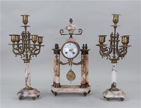 A marble garniture de cheminée consisting of a pendulum on a column and...