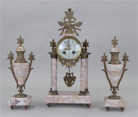 A marble Garniture deCheminée consisting of a pendulum on a column and...