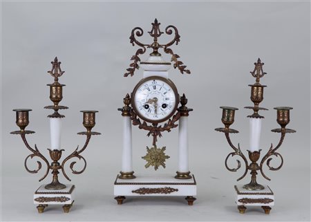 A marble Garniture de Cheminée consisting of a pendulum on a column and...