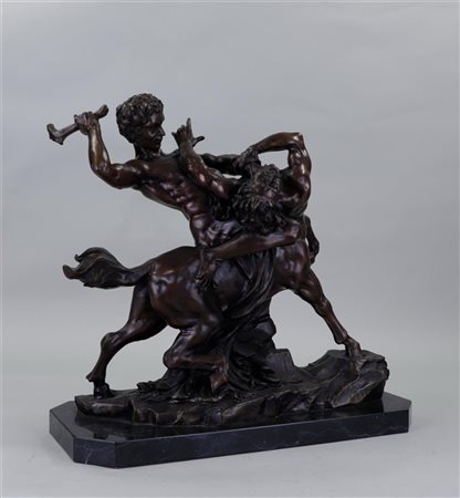 A patinated bronze sculpture depicting Hercules Fighting Centaur Nessus,...