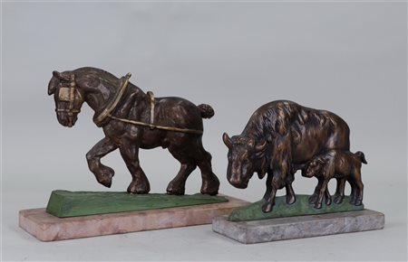 Two partly polychrome bronze figures of a workhorse and bison with calf, both...