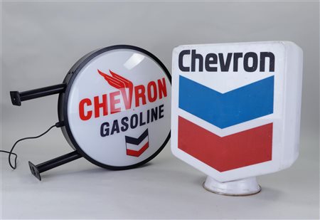 Two plastic brake pad objects 'Chevron gasoline'.