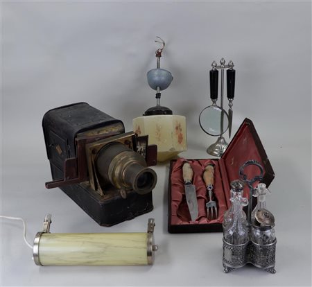 A collection of various curiosities including a magic lantern and various...