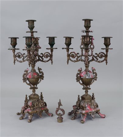 A set of two bronze 5 light candlesticks. France, circa 1900.H. 43 cm.