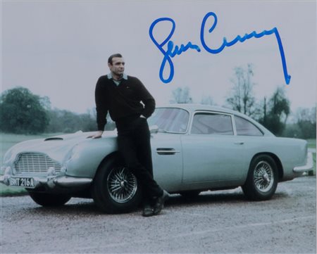 A photo of Sean Connery with the DB5 as used in Goldfinger. Signature.20 x 25...