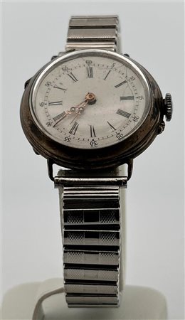 A silver pocket watch converted into a wristwatch.