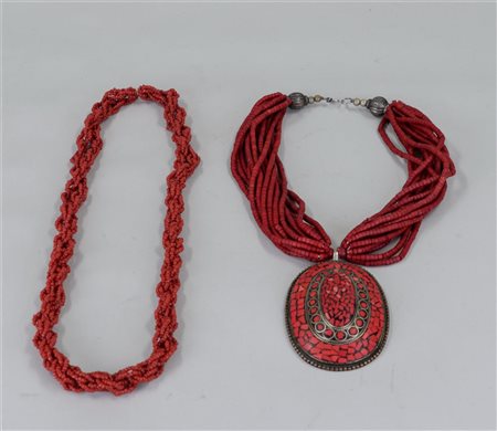 A lot consisting of two necklaces, the first consisting of red beads, the...