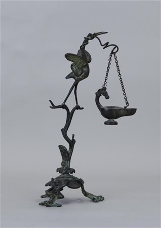 A bronze oil lamp decorated with a crane and frogs. Japan, 19/20th century.H....