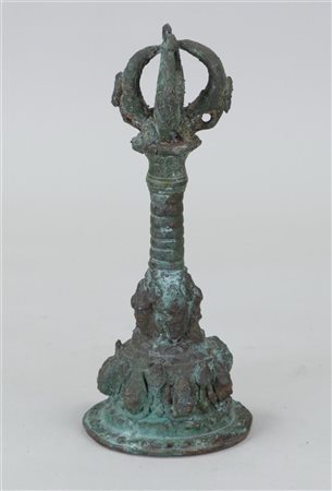 A bronze bell decorated with faces. Java.H. 23 cm.