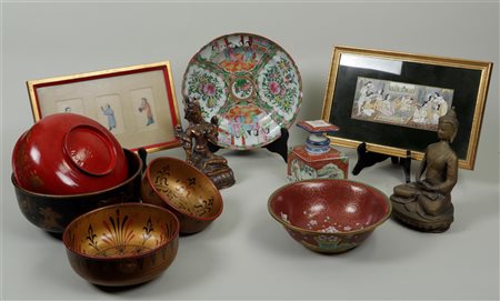 A lot of various Asian objects including bowls, Buddhas and porcelain.