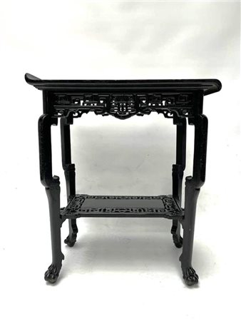 A black lacquered wooden side table. China, early 20th century.64 x 63 cm.