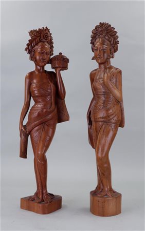 A set of two rosewood Balinese ladies. Indonesia, mid 20th century.H. 62 cm.