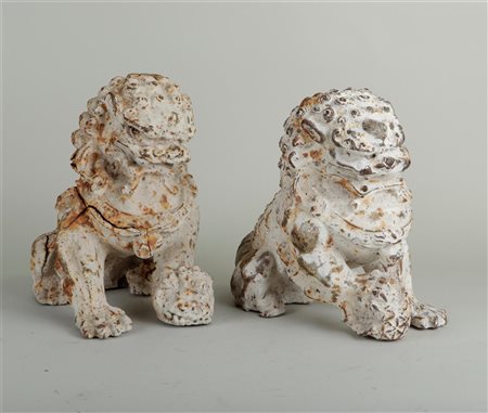 A set of two polychrome cast iron foo dogs, stamped with wax. China, 20th...