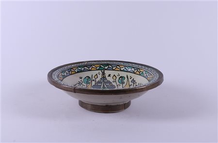 A Moroccan earthenware dish depicting a ship. Fes, Morocco, 19th century....