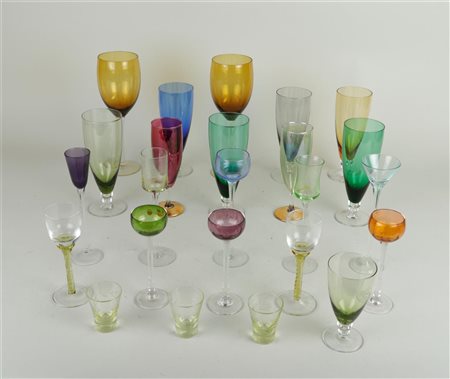 A collection of glassware including colored glasses and Murano.