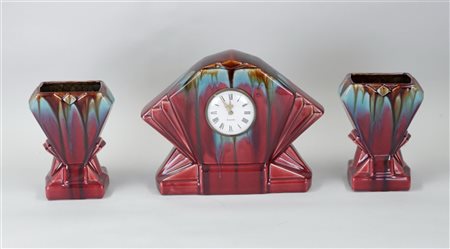 A Flemish earthenware red glazed Art Deco mantelpiece set.H. 24 cm.