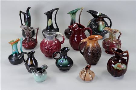 A collection of various glazed Flemish earthenware pouring jugs.