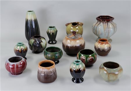 A lot of various glazed Flemish earthenware vases and pots.