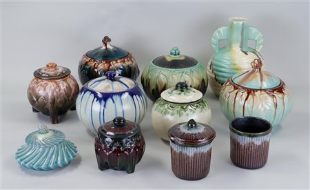 A collection of glazed Flemish earthenware covered pots.