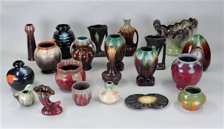 A lot of various glazed Flemish pottery including jugs and vases.