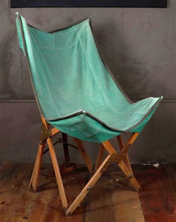 A Campain butterfly chair with green canvas upholstery, marked 'Torck', ca....